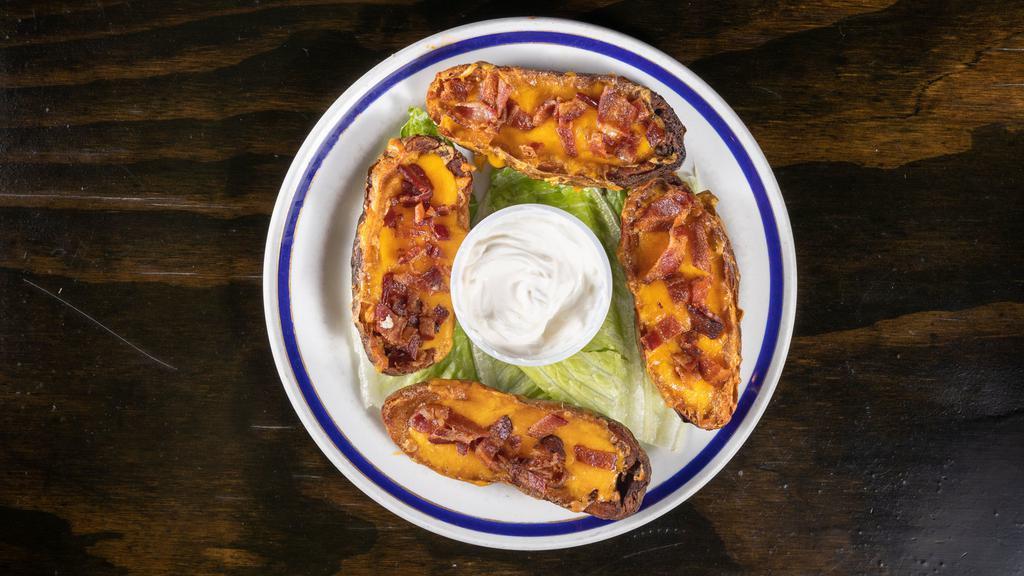 Homemade Potato Skins · Stuffed with Cheddar Cheese & Bacon Bits. Served with Sour Cream