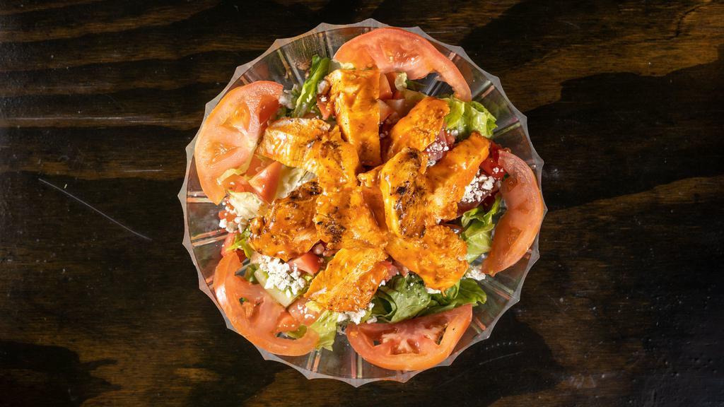 Buffalo Chicken Salad · Mixed greens with fresh chopped tomatoes, bleu Cheese crumbles & grilled chicken tossed in our Famous buffalo sauce