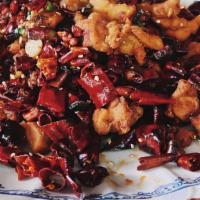 Sanchen Spiced Chicken · Wok-fried fillet with dried chilies, star anise, and cumin seeds.