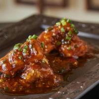 Eggplant Tempura · Vegetarian. Crispy eggplant glazed with ginger, garlic, and sesame oil.