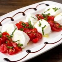 Caprese · Homemade mozzarella with cheery tomatoes and basil.