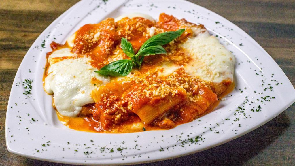 Pollo Parmigiana · Chicken cutlet, tomato sauce, homemade mozzarella, and parmigiano reggiano. No pasta.