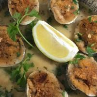 Vongole Oreganata · Baked clams on the half shell with bread crumbs, lemon, garlic and white wine.