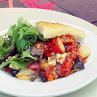 Kimolos · Tomato, eggplant, red peppers, potato, feta, olives, on French baguette. Vegetarian.
