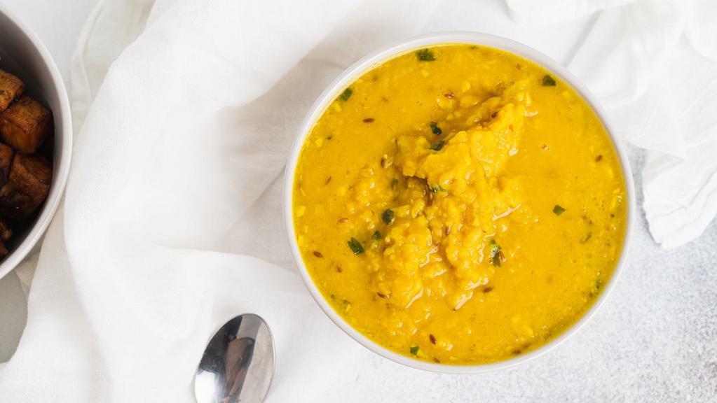 Dal Tadka · Yellow lentils cooked to perfection over fire infused with tempered spices.