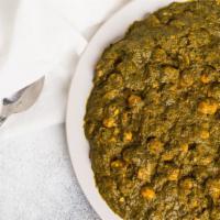 Saag Chana · Finely chopped garden fresh spinach cooked with homemade cottage cheese or chickpeas and del...