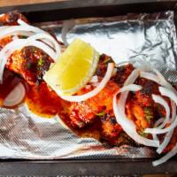 Murgh Ka Sula · Succulent pieces of chicken marinated in red chilies, hung yogurt, and special spices.