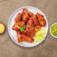 Busy Bee'S Honey Bbq Wings	 · Fresh chicken wings breaded, fried until golden brown, and tossed in honey and barbecue sauc...