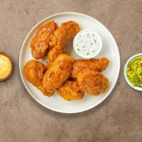 Mango Tango Habanero Wings · Fresh chicken wings breaded, fried until golden brown, and tossed in mango habanero sauce. S...