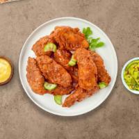 Nashville Native Hot Wings · Fresh chicken wings breaded, fried until golden brown, and tossed in Nashville hot sauce. Se...