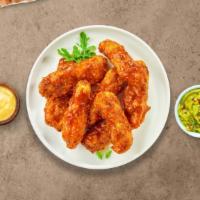 It Takes Two To Mango Habanero Tender · Chicken tenders breaded, fried until golden brown before being tossed in mango habanero sauce.