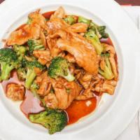 Sliced Chicken With Broccoli · Served with white rice.