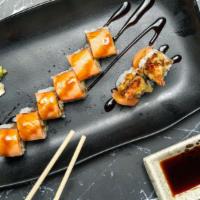 Crazy Dragon Roll · Spicy Tuna roll with eel masago outside.