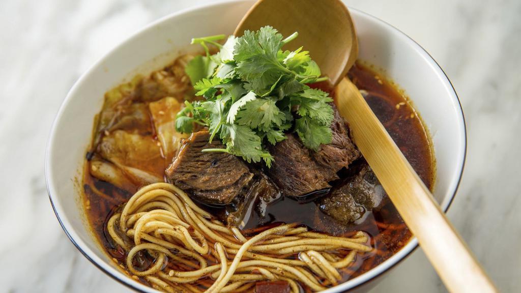 Hotpot Beef Noodle Soup · Chongqing hotpot is famous for rich, spicy, and numbing soup with beef tallow. We use traditional ingredients to make the soup base, which we braise the tender beef in.