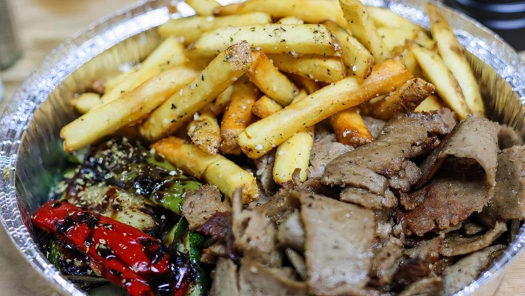 Gyro Platter · served with fries or rice, grilled vegetables, tzatziki sauce & pita bread and choice of Greek salad or soup