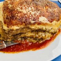 Meatless Moussaka · Layers of eggplant, potatoes, zucchini topped w/ béchamel sauce