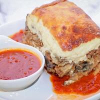 Moussaka · Layers of eggplant, potatoes & ground beef topped with béchamel sauce