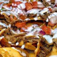Loaded Nachos · Corn tortilla chips, house queso, choice of pulled pork, pulled chicken or black beans, pico...