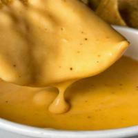Chips & Queso · Corn tortilla chips and house queso.