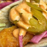 Baja Fish Taco · Crisp cod, shredded lettuce, pickled onions, jalapeños, and spicy mayo.
