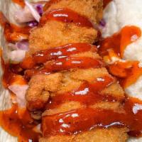 Nashville Hot Taco · Crispy fried chicken, pickle slaw and hot sauce.