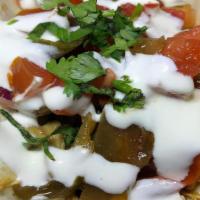Fajita Chicken Taco · Pulled chicken, fajita veggies, cilantro, and sour cream.