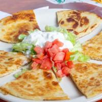 Quesadillas · Melted jack cheese in a flour tortilla with guacamole, pico de gallo, and sour cream on the ...