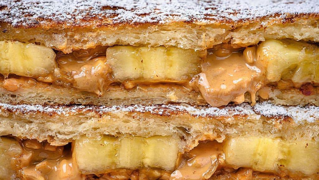 The Pbbh · Choice of crunchy or smooth peanut butter, sliced banana, honey drizzle, topped with powdered sugar.
