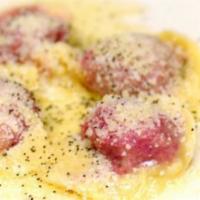 Casunziei · Red beet and ricotta ravioli, melted butter and poppy seeds.