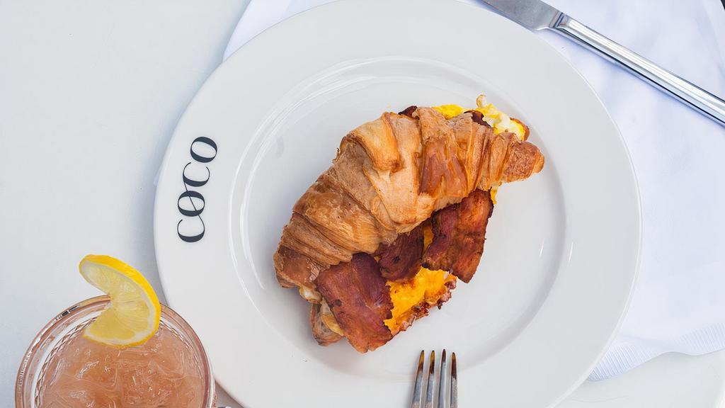 Breakfast Croissant · Eggs, Bacon, Aged American Cheddar.