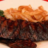 Prime New York Strip Loin Steak · With French fries.