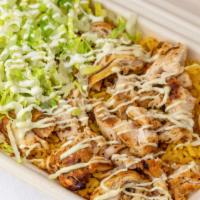 Chicken Over Rice · Yellow rice with chicken garnished with our special white sauce and shredded lettuce