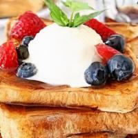 Frensh Toast  · 2 SLICE OF FRENCH TOAST ON A PLATTER WITH YOUR CHOICE OF ADD ONS (COMES WITH SYRUP ON THE SI...