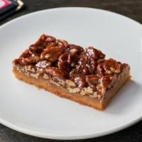 Caramel Pecan Bar · A buttery crust topped with whole pecans coated in caramel.