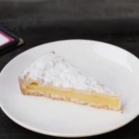 Torta Della Nonna · Pastry cream with a hint of lemon on a base of shortcrust pastry, covered with pine nuts, al...