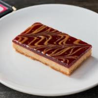 Raspberry Linzer Bar · A buttery shortbread crust topped with premium jam.