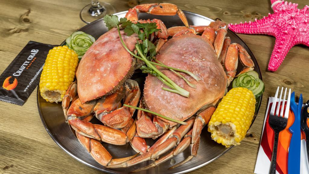 Dungeness Crab · Your fresh catch is boiled in our secret spices and then blended with one of our crafty crab signature seasonings and served in a bag to preserve the flavors. Each pound comes with potato and corn on the cob.