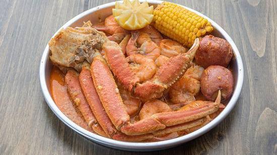 1/2 Lb Combo...Snow Crab & Headless Shrimp · 1/2 LB of Each. Comes with Potatoes and Corn.
