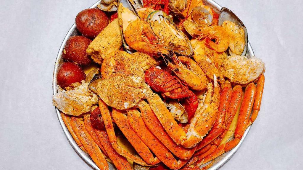 Seafood Platter · Snow crab (2 clusters), whole shrimp (1/2 lb), crawfish (1/2 lb), mussels (1/2 lb), clams (1/2 lb), two corns, and three potatoes, (not sold by the pound, cannot be substituted).