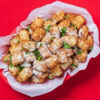 Garlic Parm Tots · Grated potato puffs tossed in our signature Garlic Parm dry rub! 280-640 cal.
