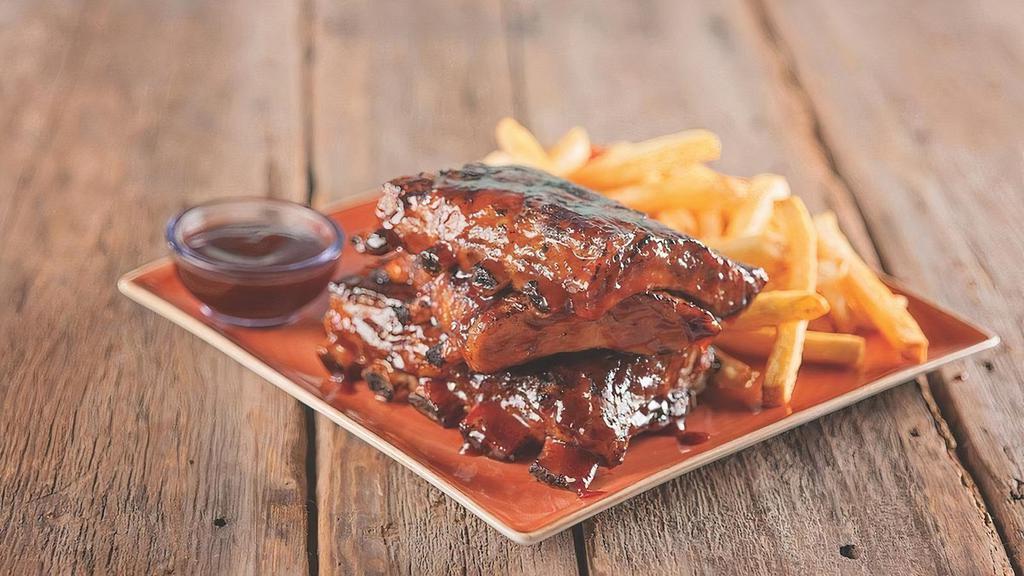 Bbq Ribs · Fork tender baby back ribs seasoned and basted with signature BBQ sauce served with french fries. 1960 cal.