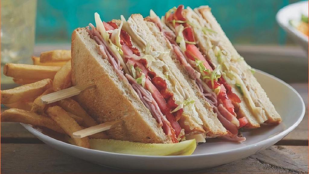 Beach Club · Sliced roasted turkey and ham, swiss cheese, applewood-smoked bacon, lettuce, tomato and Hellmann’s® real mayonnaise on toasted country white bread. 1070 cal.