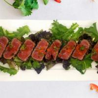 Pepper Tuna · 8 pieces of pepper bluefin tuna, scallion, masago with ponzu sauce.