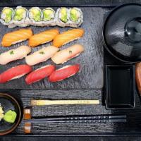 Triple Sushi · 3 pieces of salmon, 3 pieces of bluefin tuna, 3 pieces of yellowtail and california roll, se...