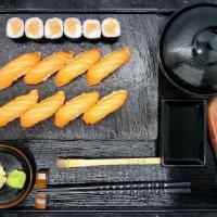 Salmon Sushi Dinner · 8 pieces of salmon sushi and salmon roll, served with soup or salad, and fresh wasabi.