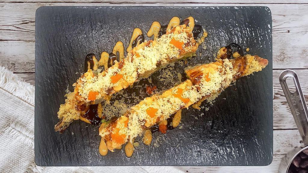 Dream Roll · In: shrimp tempura, avocado
Out: spicy kani
Top: eel sauce, spicy mayo, masago