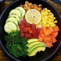 Tuna Poke Bowl · Tuna, avocado, cucumber, seaweed salad, sweet corn, papaya, peanut, masago, lime squeeze, po...