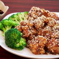 Sesame Chicken 芝麻鸡 · Lightly Breaded white meat chicken sautéed in our homemade sauce, serve with jasmine white r...