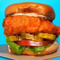 Buffalo Chicken Sandwich · Fried chicken sandwich tossed in our signature homemade buffalo sauce served with lettuce, t...