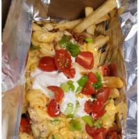 Messy Disco Fries · Fries, chilli, queso macaroni, sour cream, tomatos, chives and Jalapeno peppers